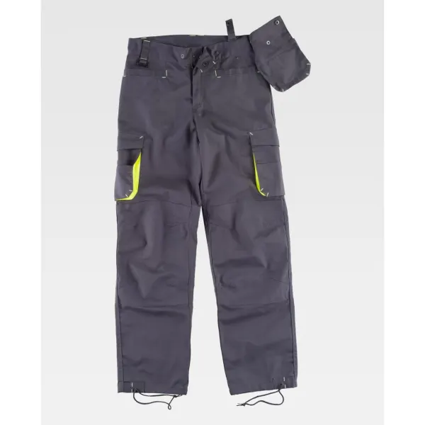 Calça combinada com reforços, detalhes fluorescentes-refletores e presilhas em contraste.